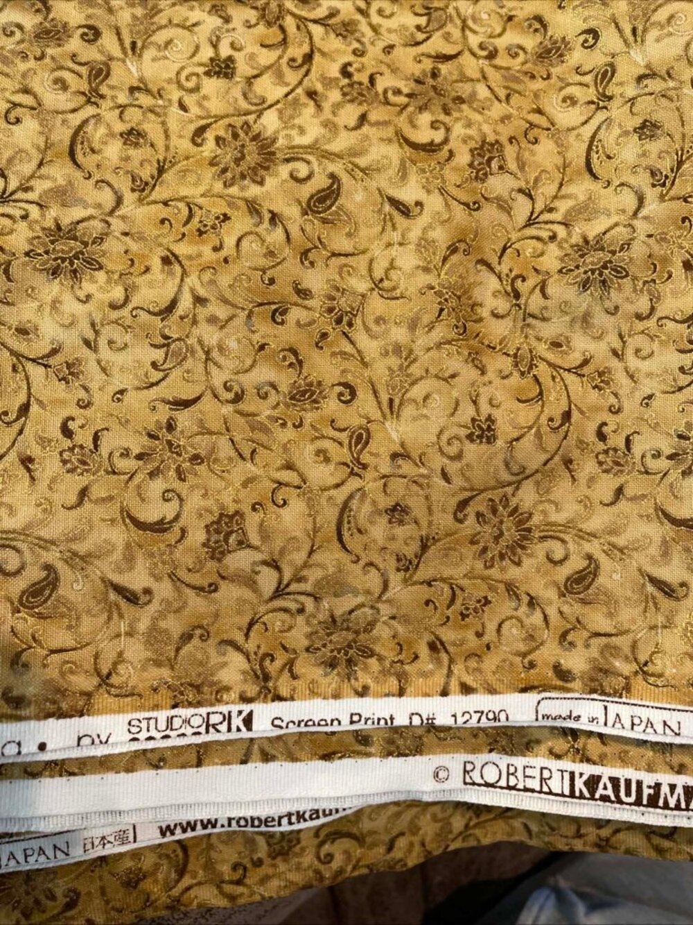 Robert Kaufman.  La Scala 4, Floral in Gold.  Sold by the yard.